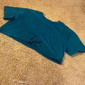This is a blue/green sports shirt you can tighten on the bottom. It is cropped